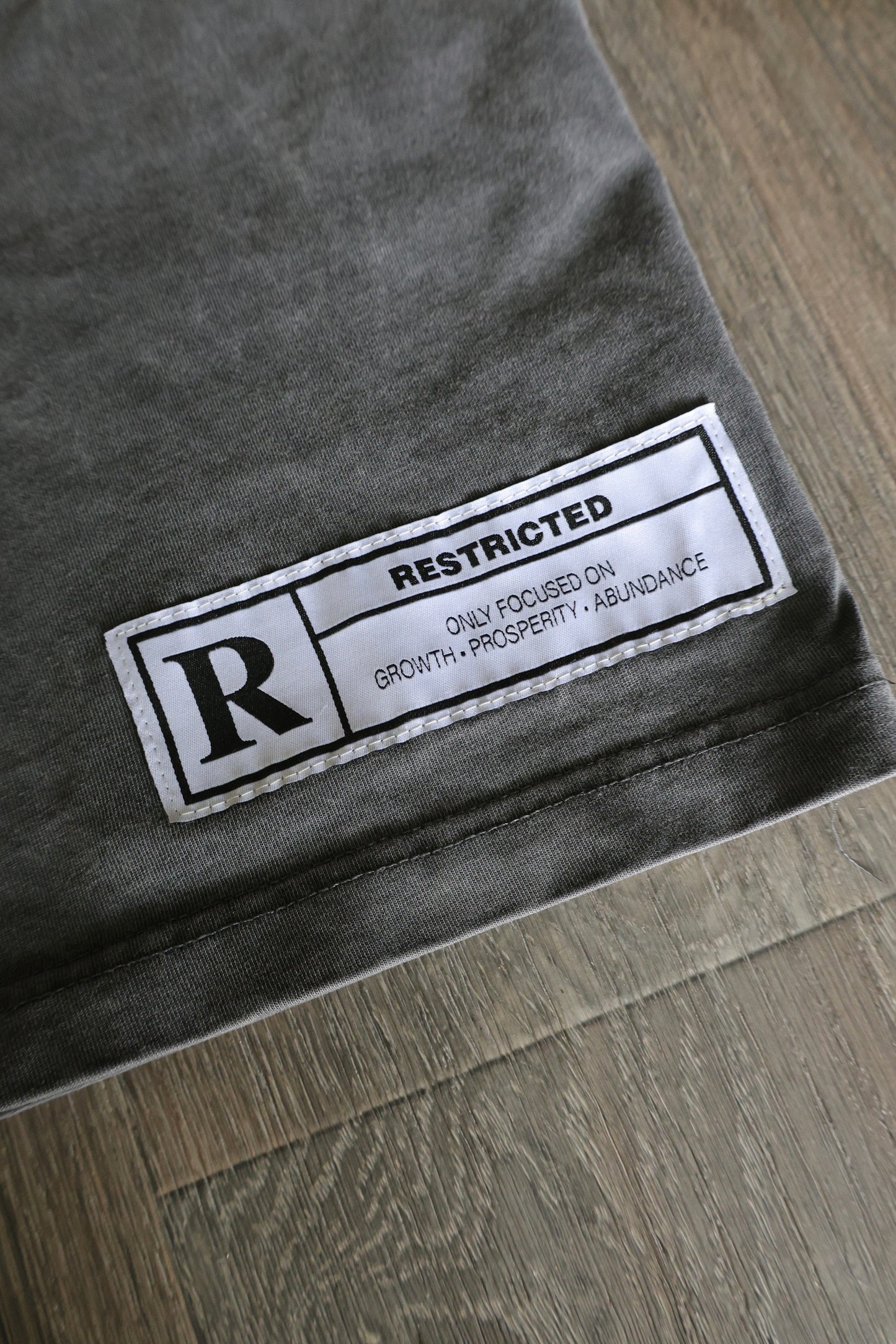 BLACK “RESTRICTED” TEE